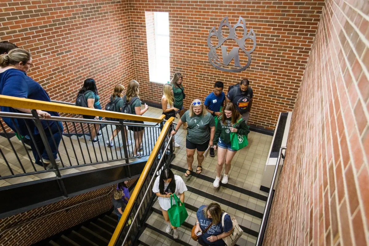 Students and their families take a break for lunch in the Bearcat Commons.